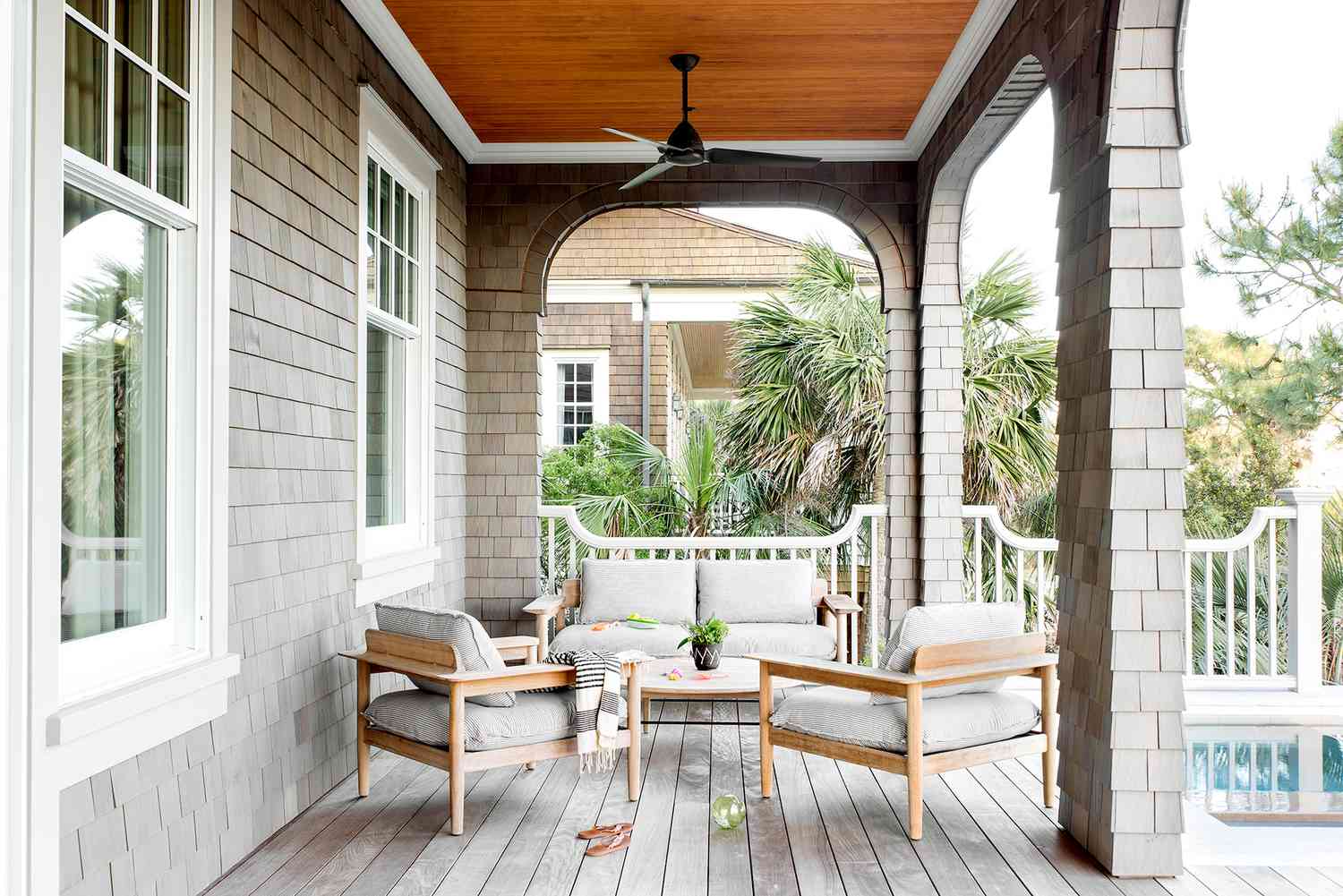 Wooden porch with seating and table