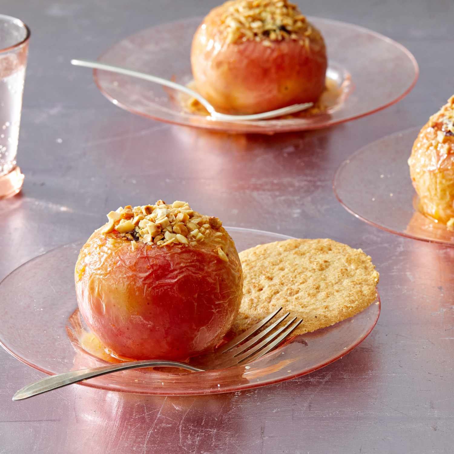 baked apples with cookie on plate