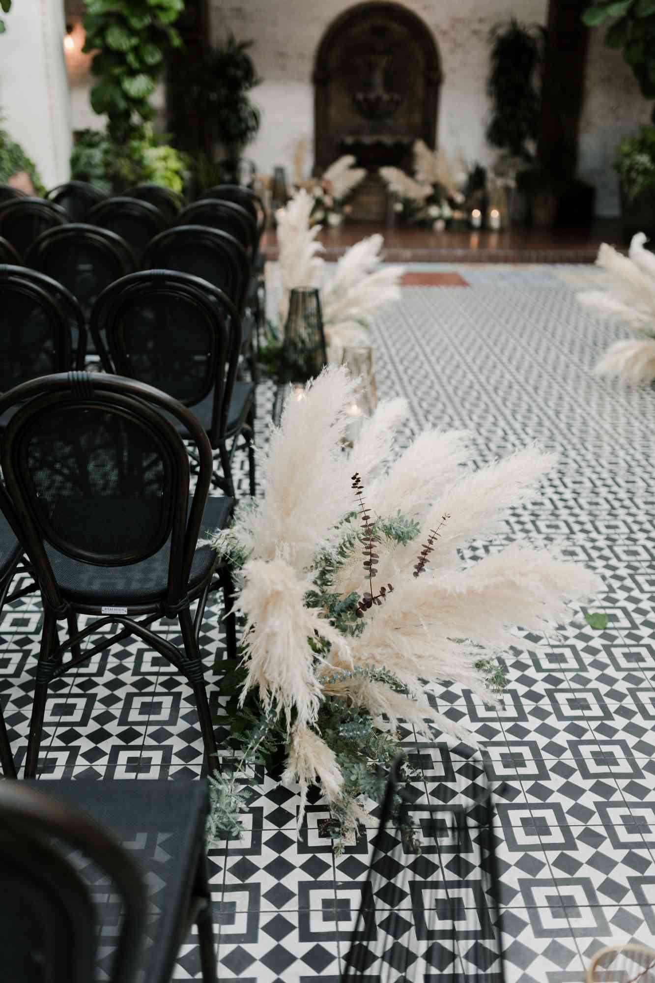 wedding aisle décor - pampas grass for aisle decoration in the black and green shade