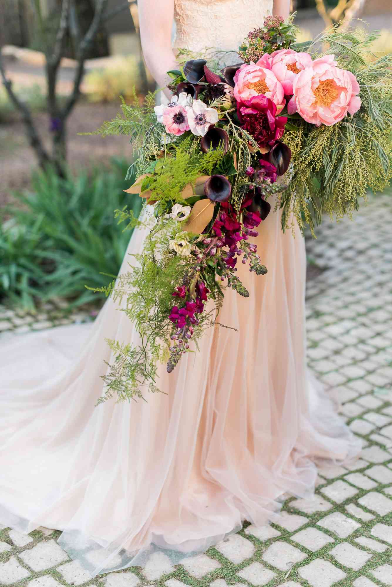 cascade bouquet with greenery calla lilies and anemones