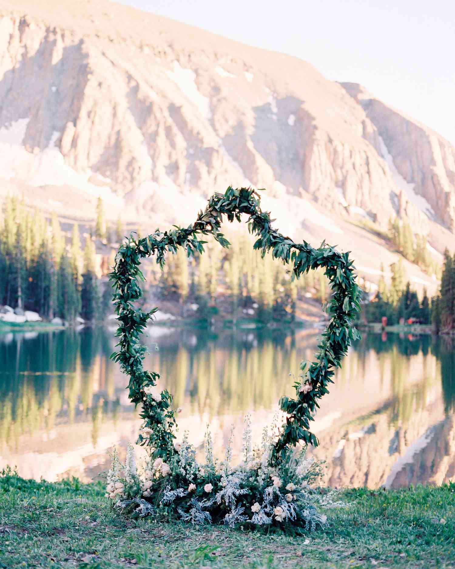 Unkempt Willow Branch Wedding Arch with Pink and Orange Flowers
