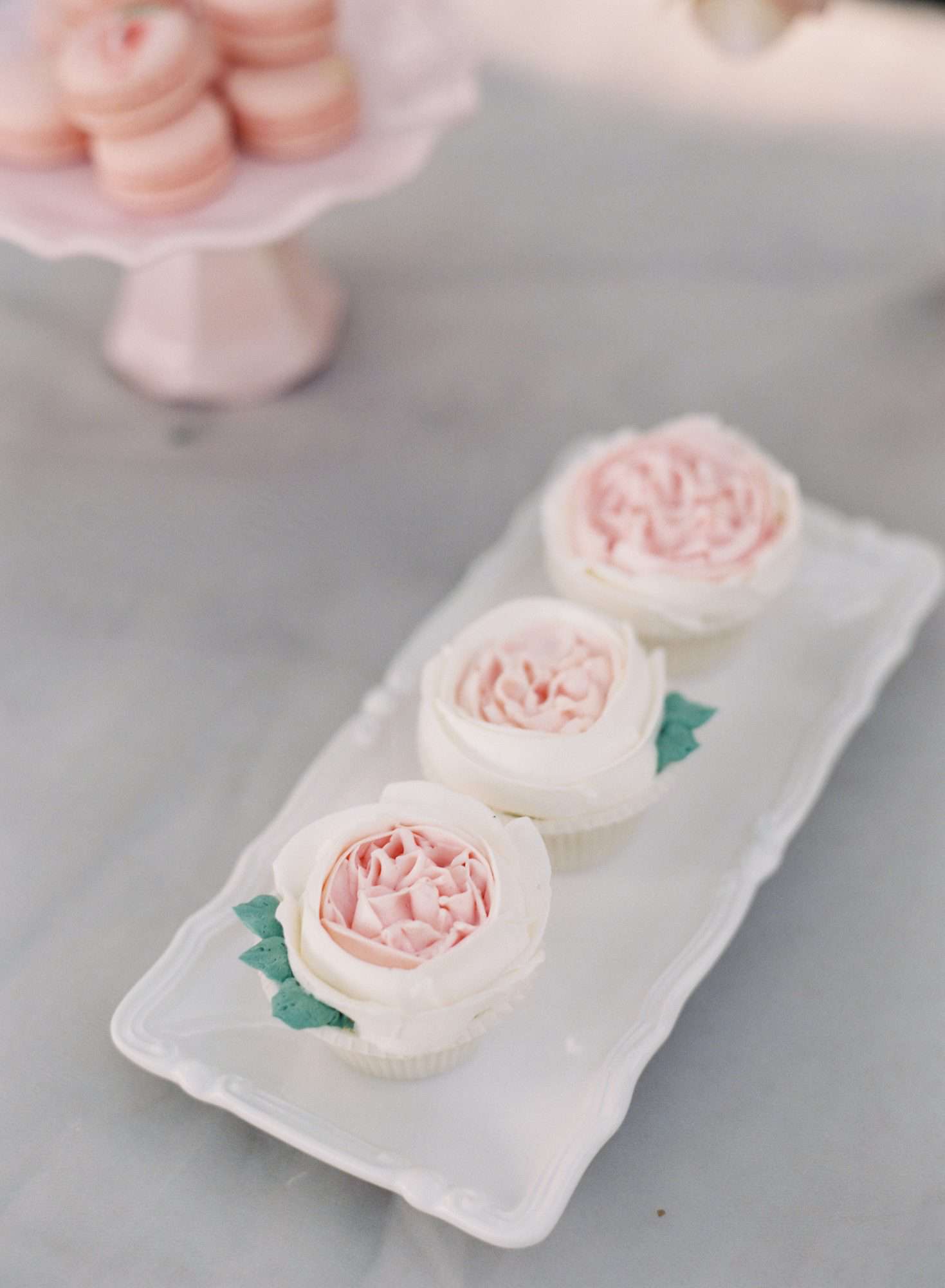 pink frosted cupcakes with roses