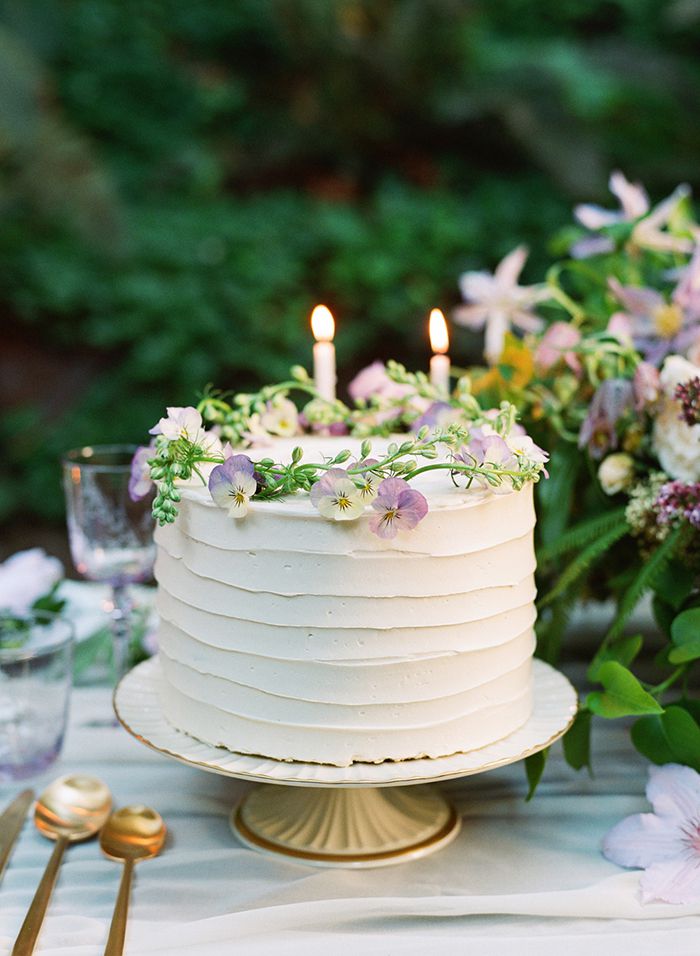 single layer white wedding cake with woodland wreath