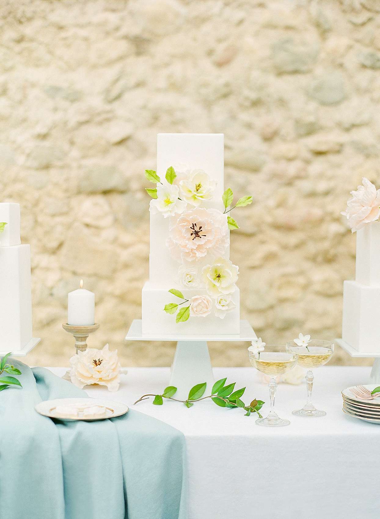 three tiered square white wedding cake
