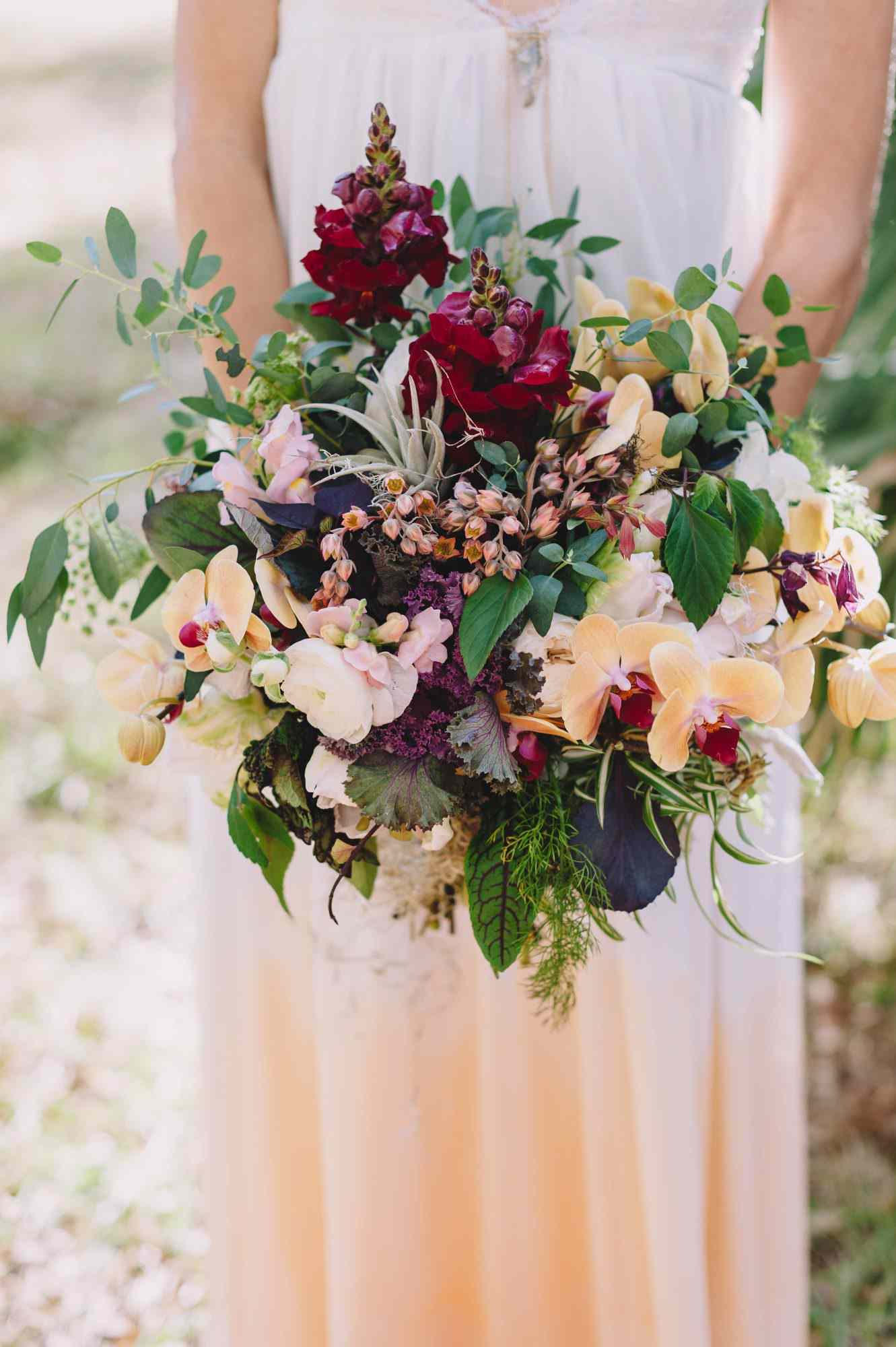 Peach and burgundy wedding bouquet with orchids