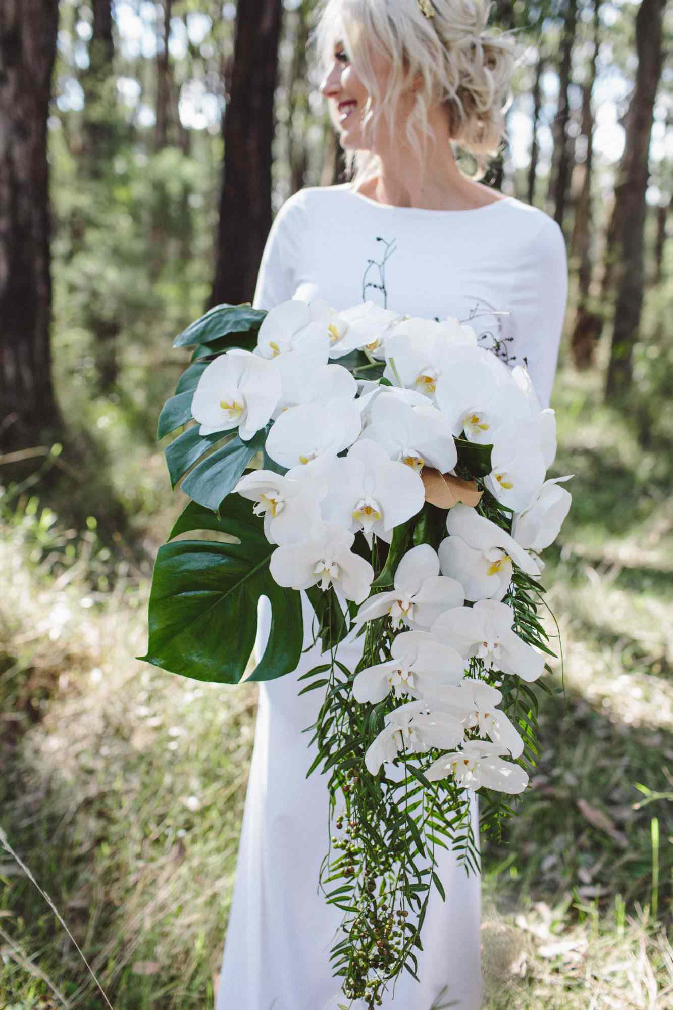White orchid and monstera deliciosa wedding bouquet