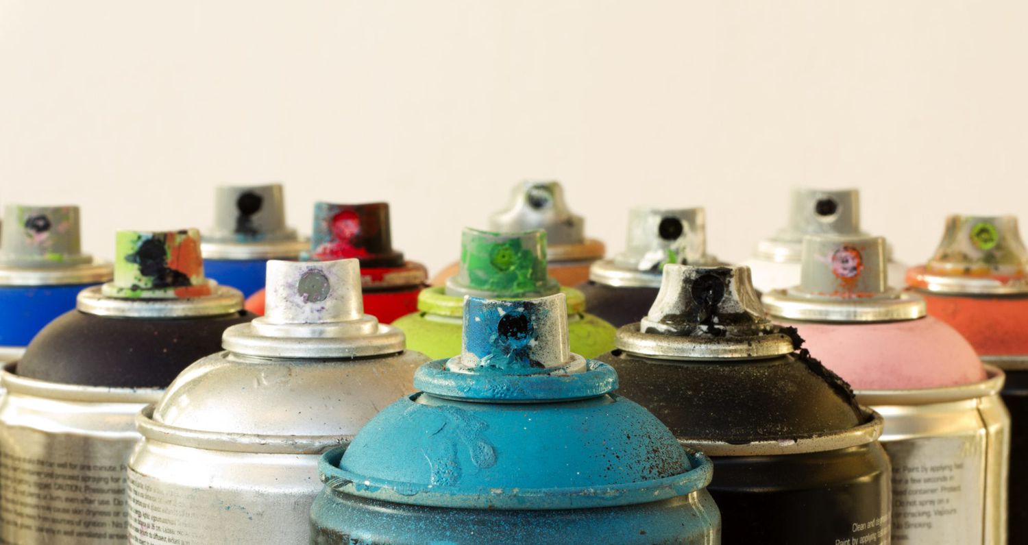 close-up of spray paint cans