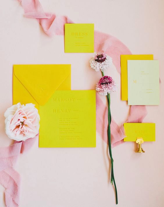 neon yellow invitations with pink accents