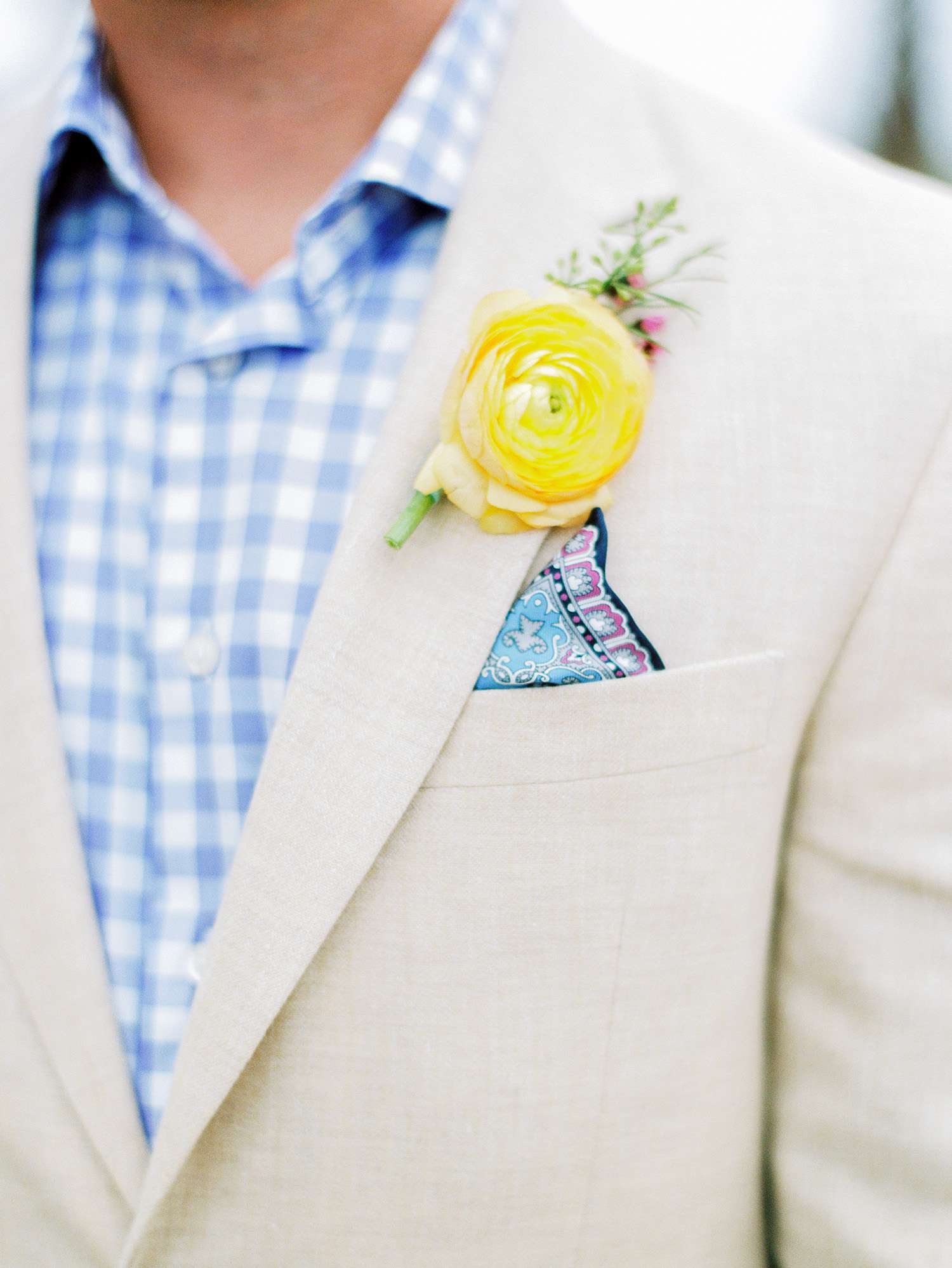 neon yellow boutonniere on suit jacket