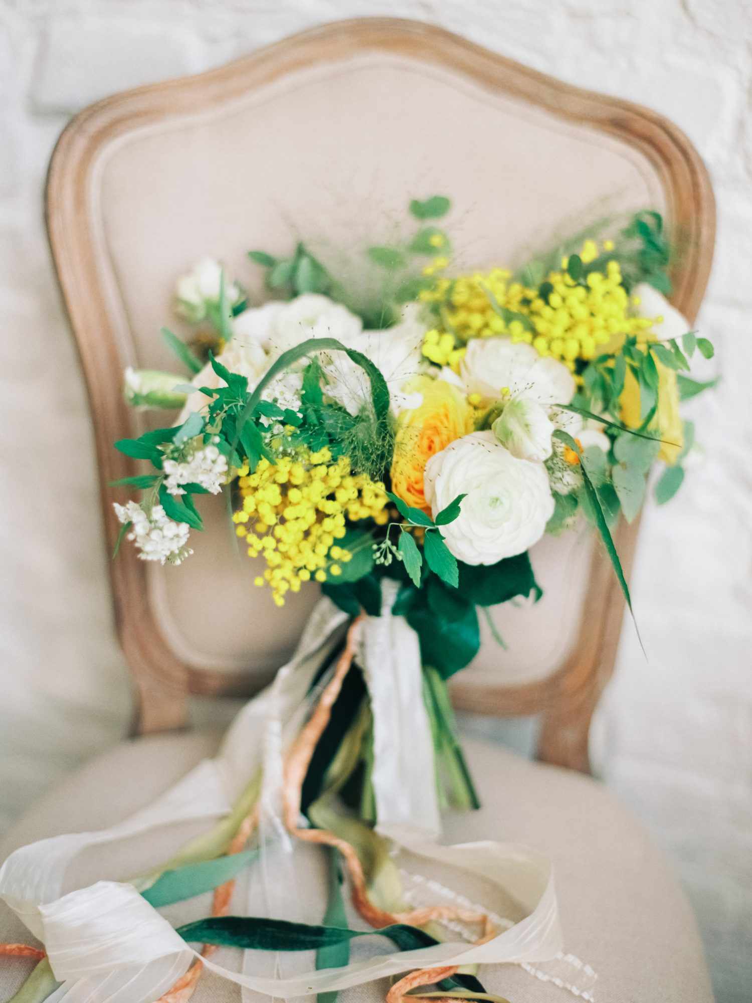 White and Yellow Bouquet on a Chair