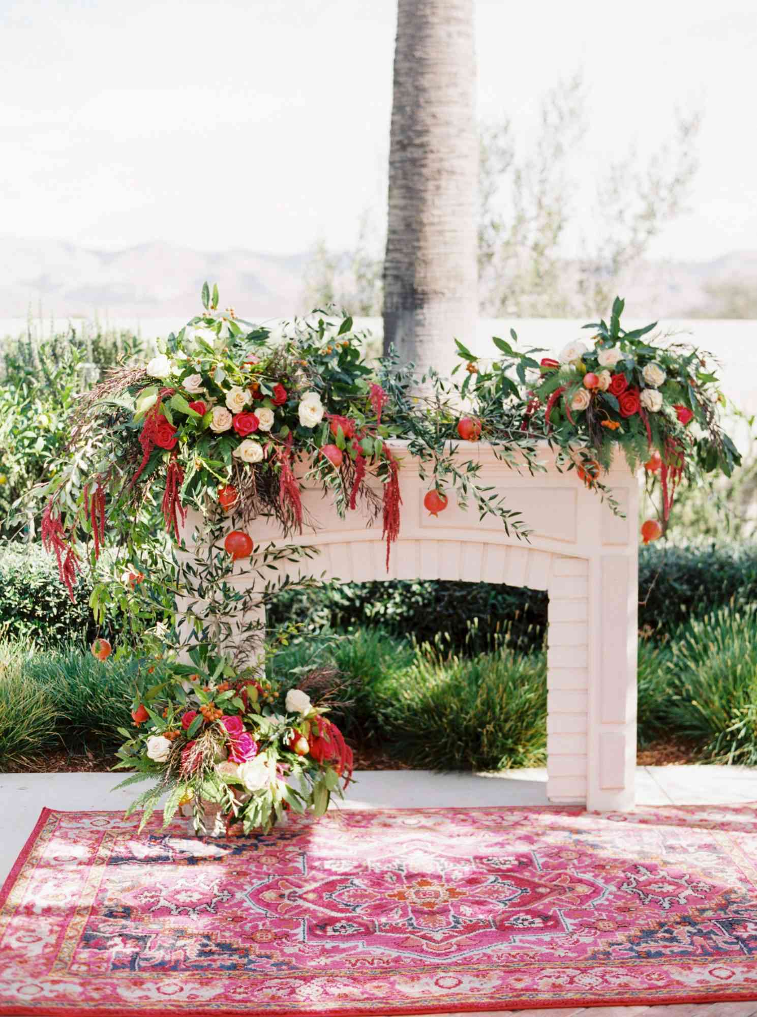 freestanding fireplace backdrop floral arrangement