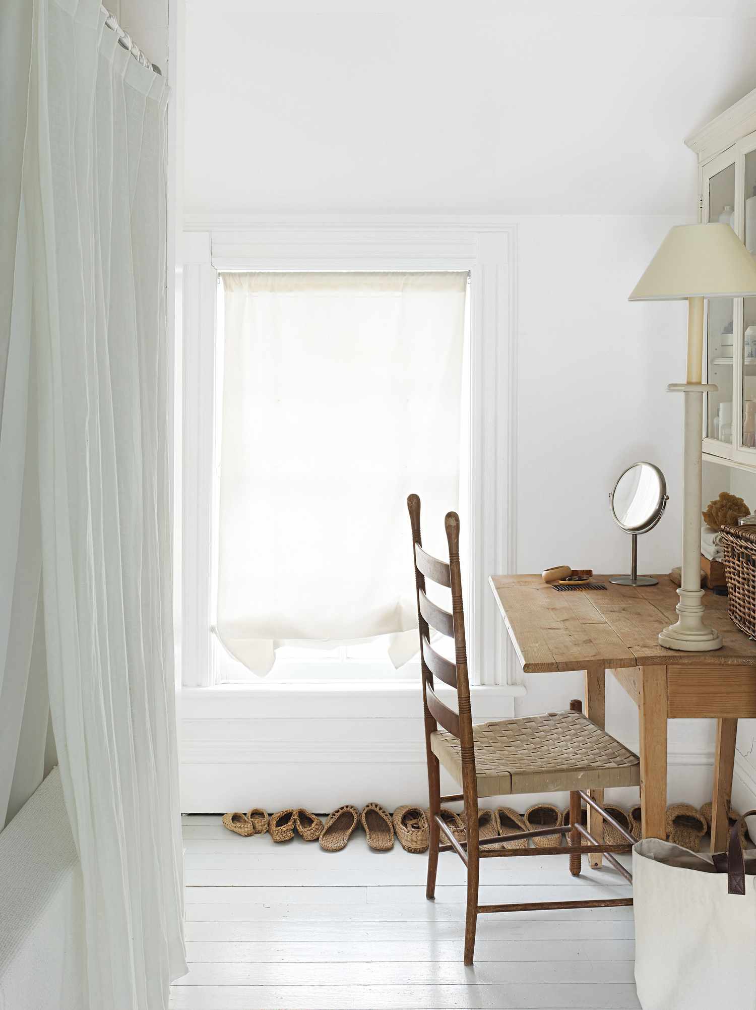 white room with light wood table