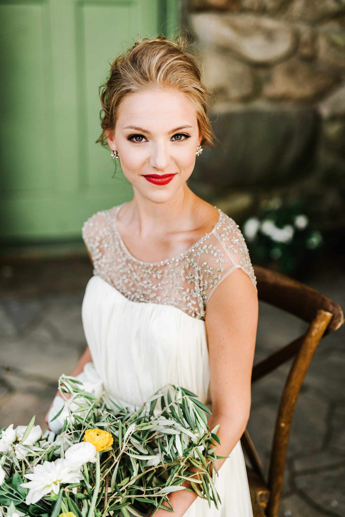 bold lipstick seated bride with bouquet