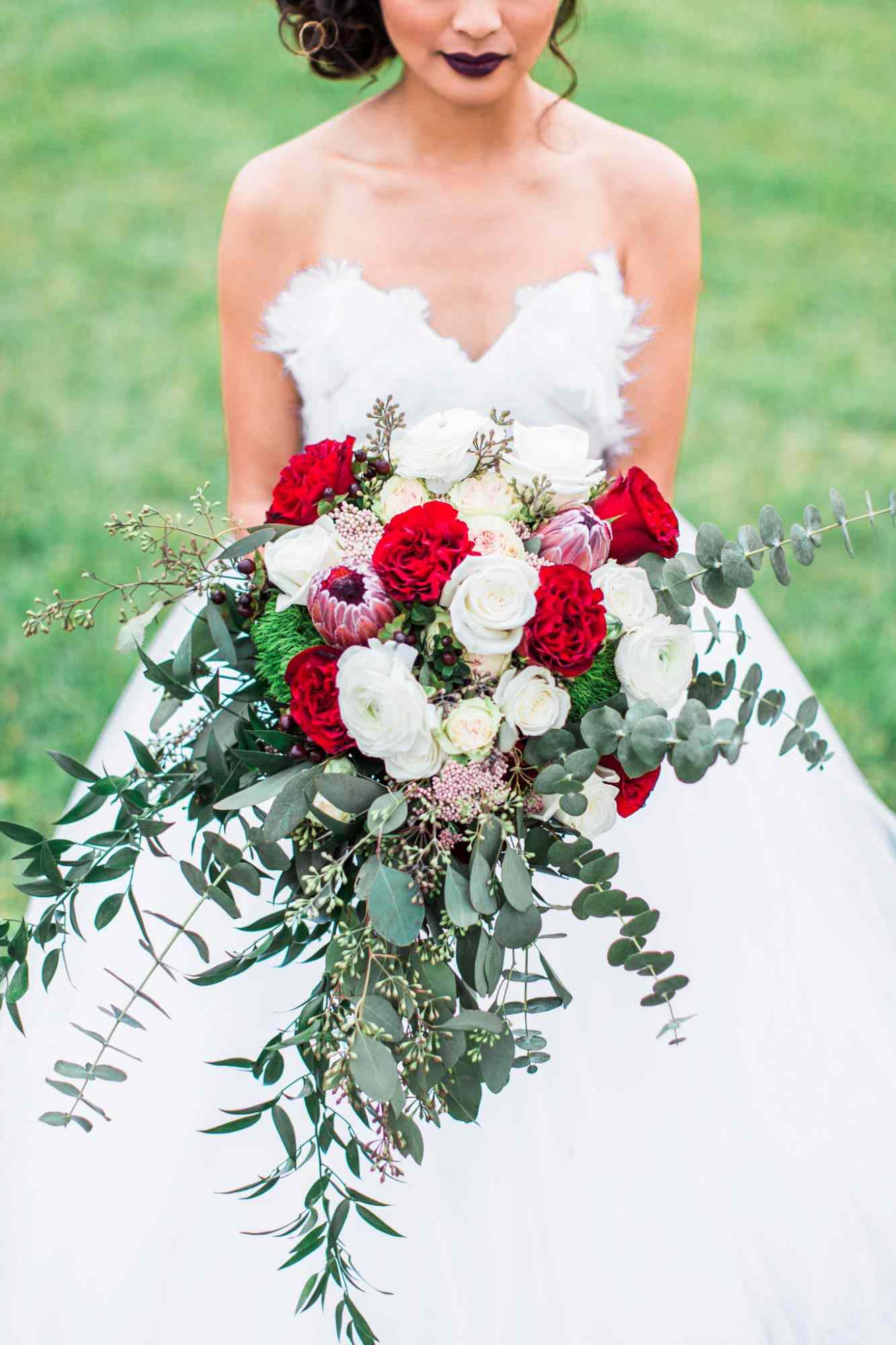 bold lipstick bride with red and white bouquet