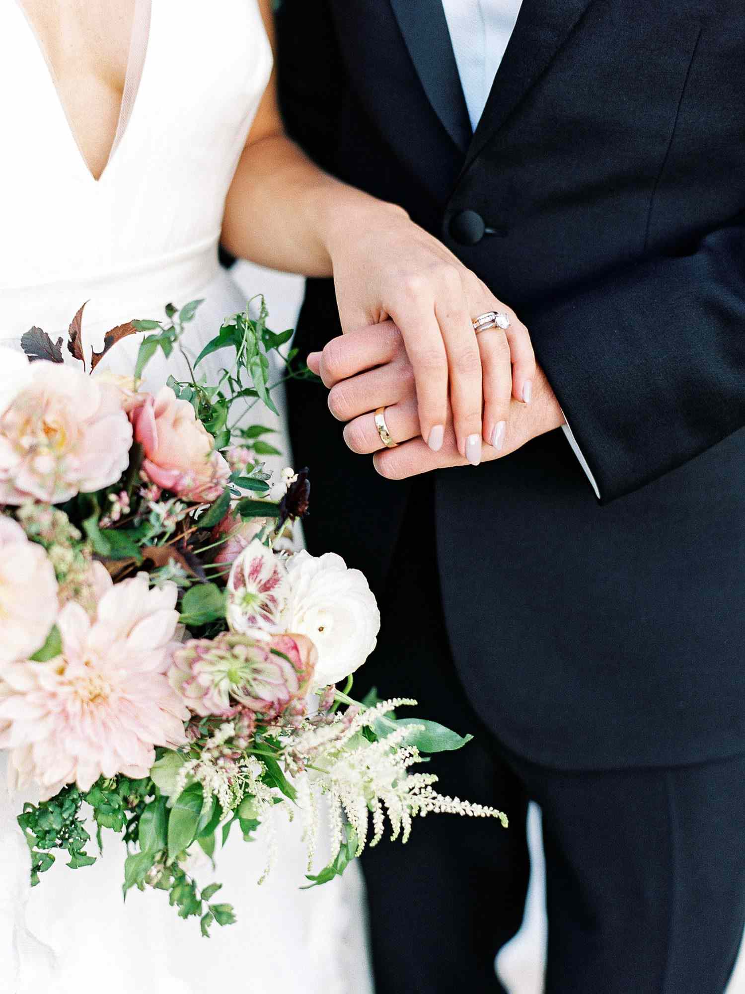 julianne aaron wedding couple hands rings