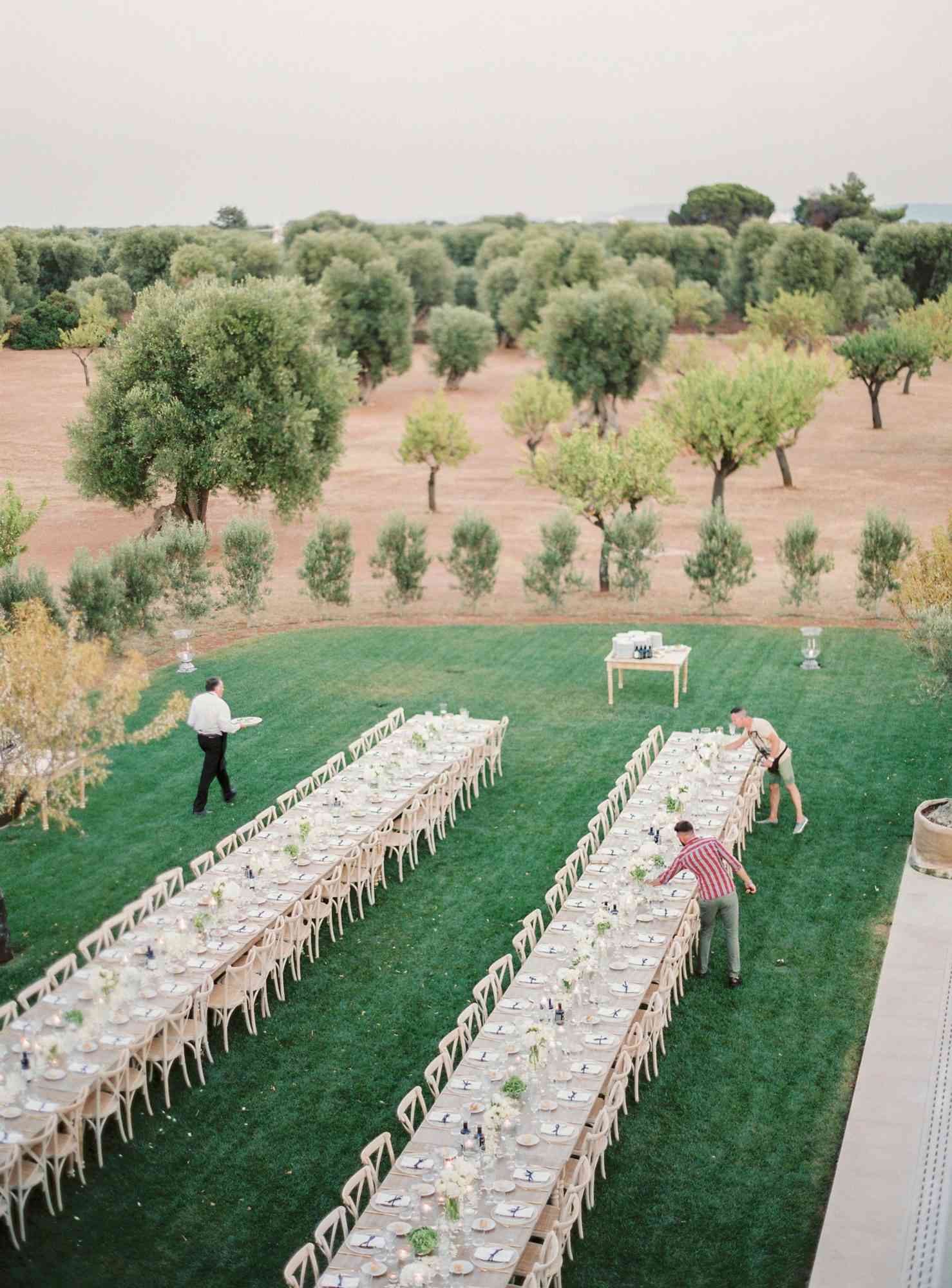 vendors setting up tables for a wedding reception