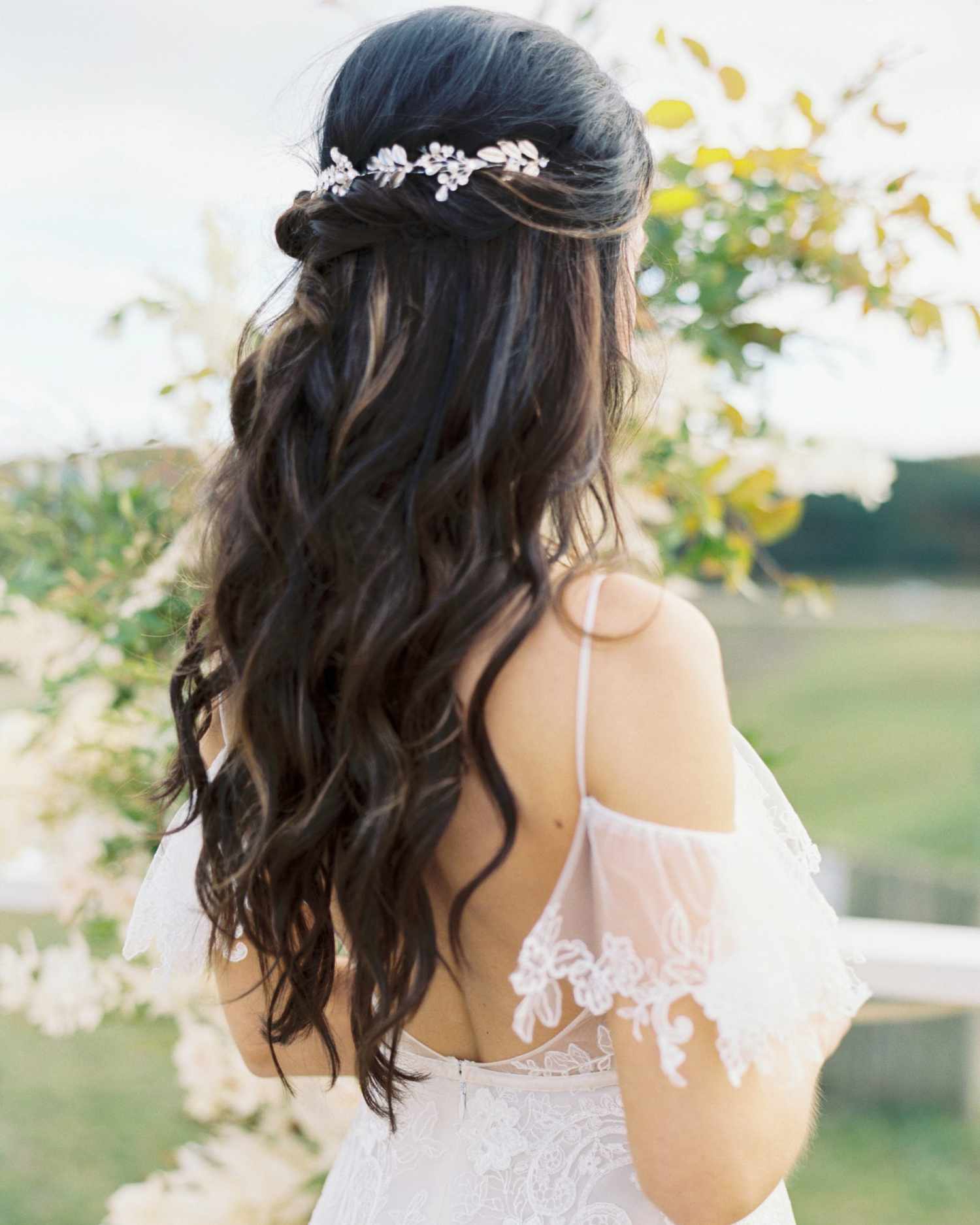 sparkly, leaf-like hairpiece in half-up half-down hairstyle