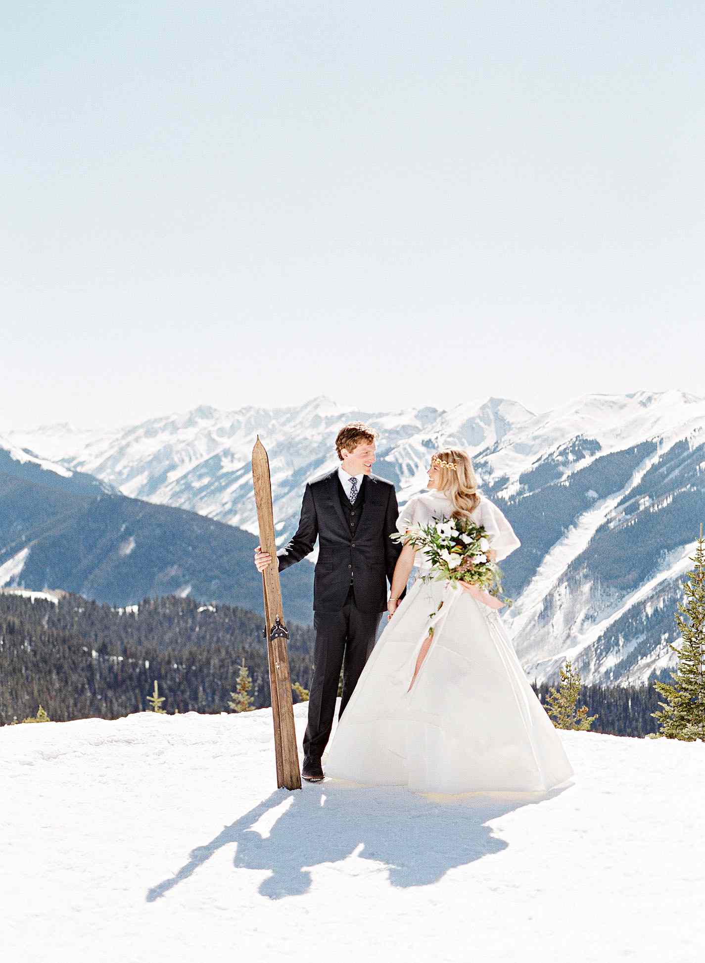 bride and groom portrait snow mountains