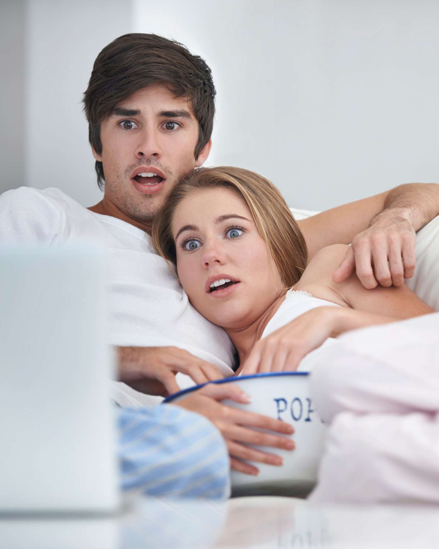 shocked-scared-couple-on-couch-watching-movie-with-popcorn-0116.jpg