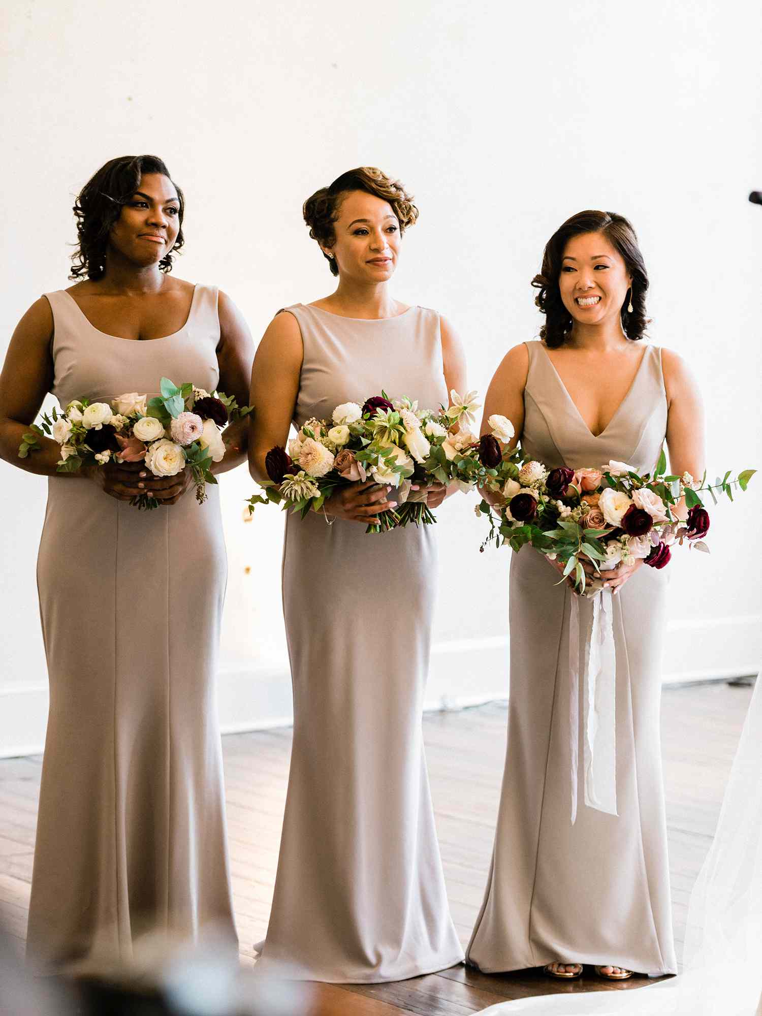 bridesmaids and maid of honor with ribbon bouquet