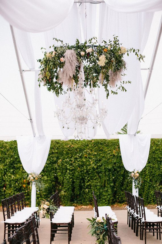 chandelier with greenery and rustic decor accents