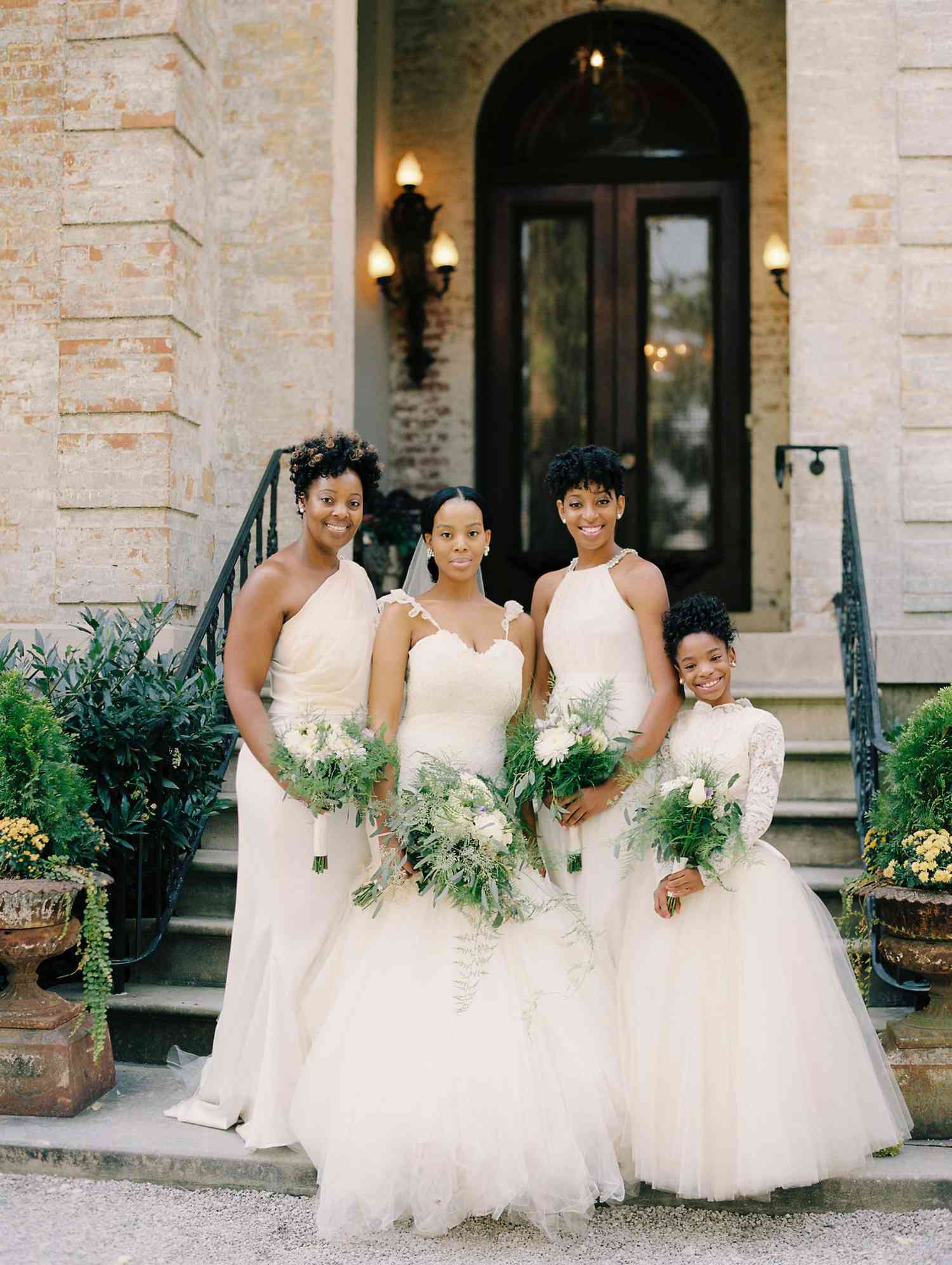 bridesmaids and bride in white