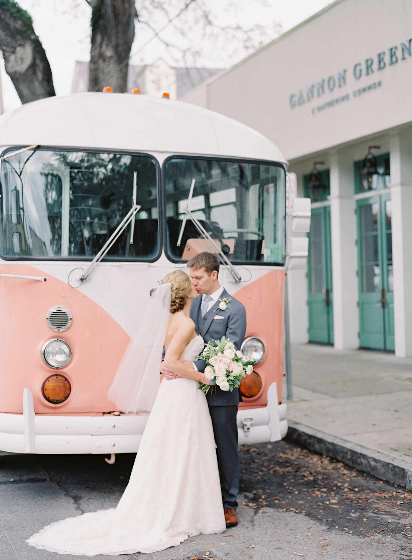 unique wedding color palettes couple kissing in front of pink vintage volkswagen bus