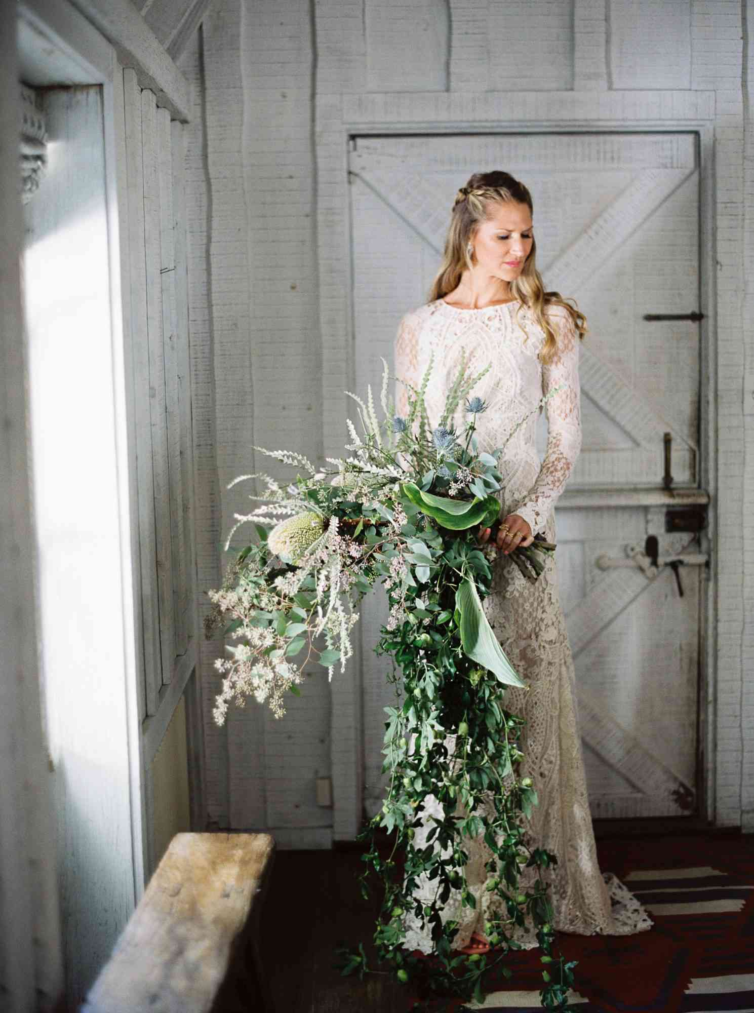 cascading wedding bouquet - oversize rustic wedding bouquet made with greenery and wild flowers