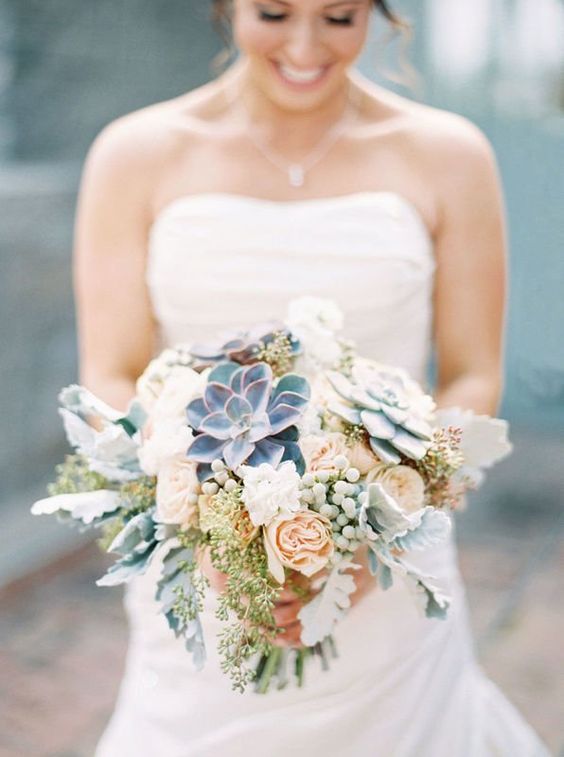 green-and-blue succulents with mint-hued berries wintry bouquet