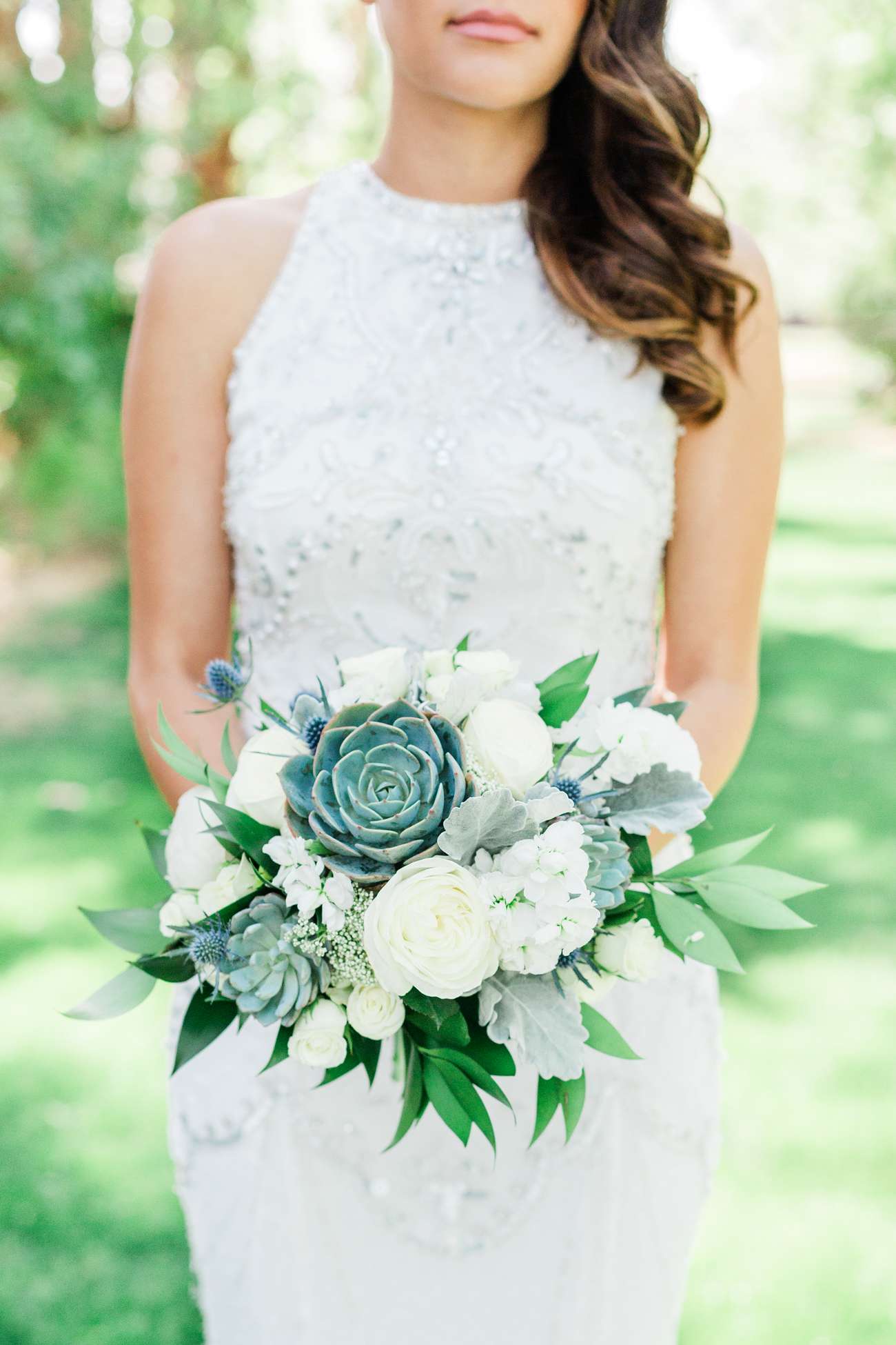 white floral and green succulent wedding bouquet