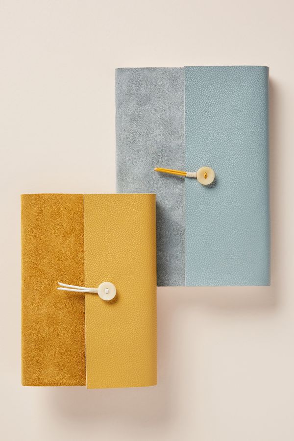 tan and blue vow books with fold over tie