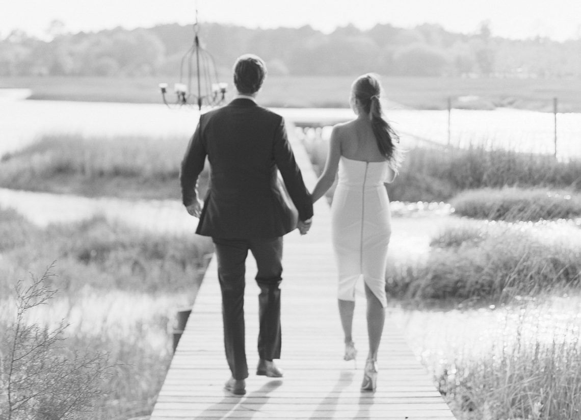 Black and White Engagement Photo of a Couple Walking