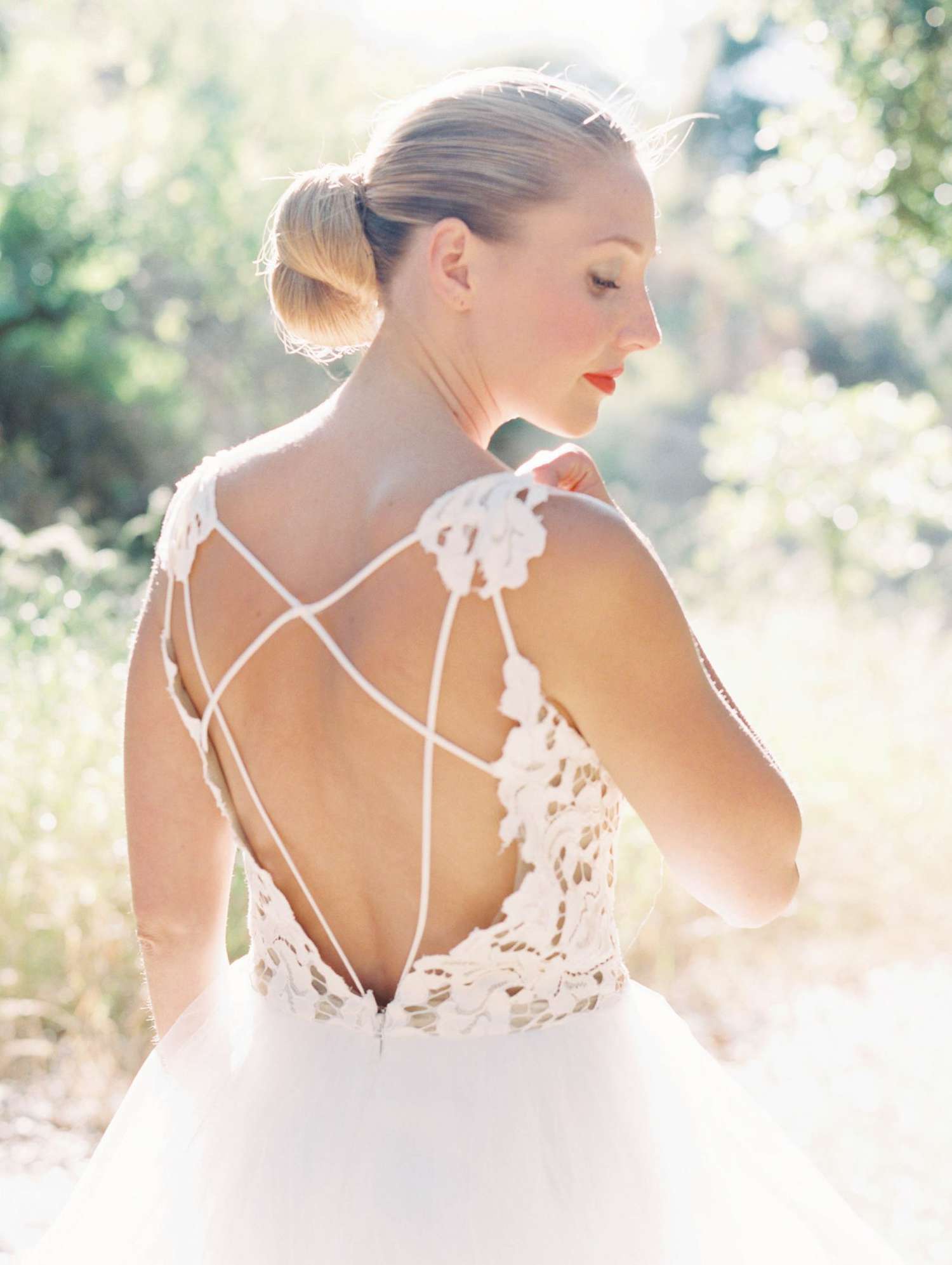 A Bride with a Wedding Dress That Features Lined Back Details