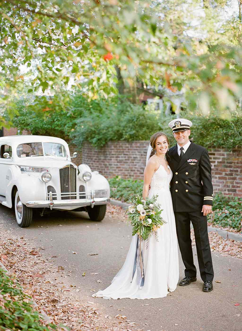anne and staton wedding portrait with car