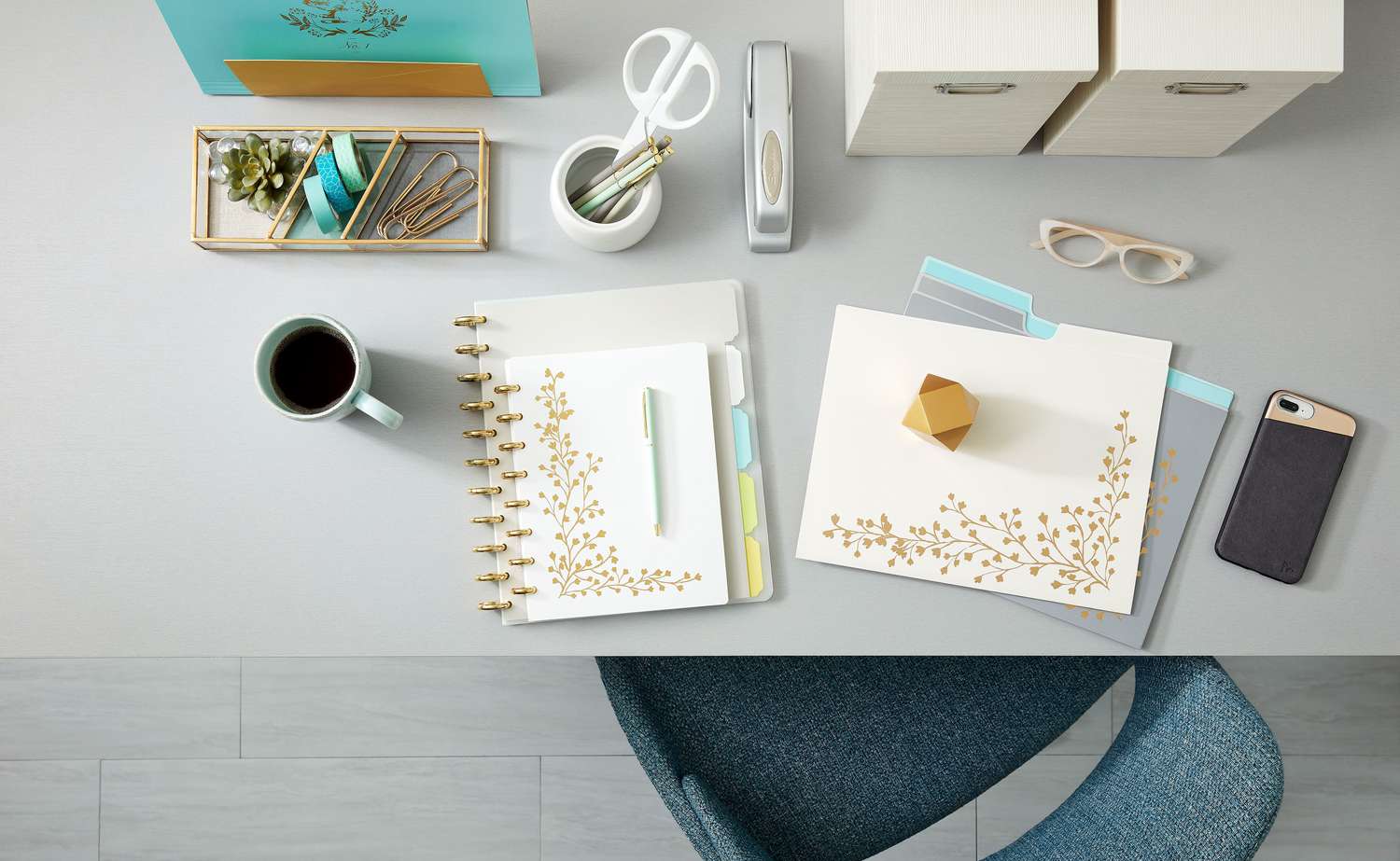 staples white gold notebooks on desk merch