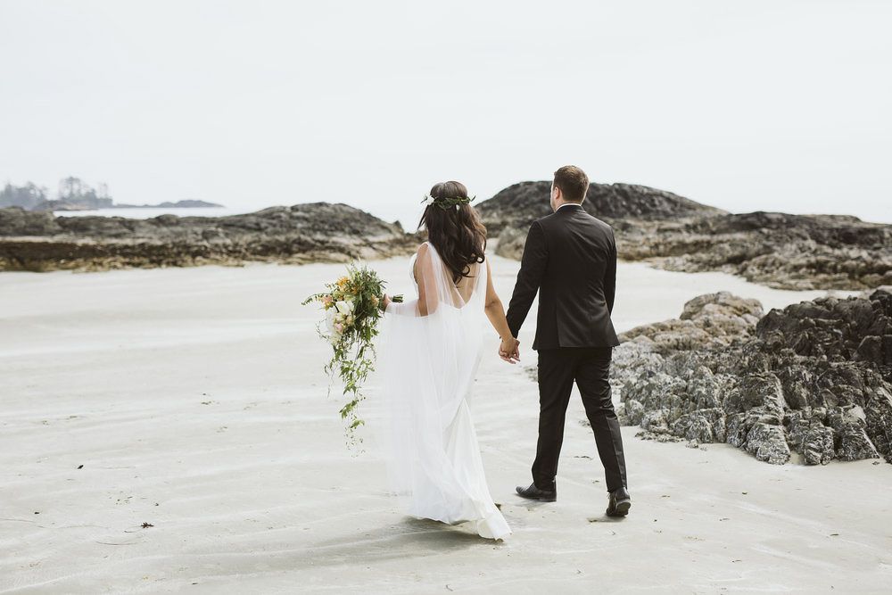bride groom walking along beach