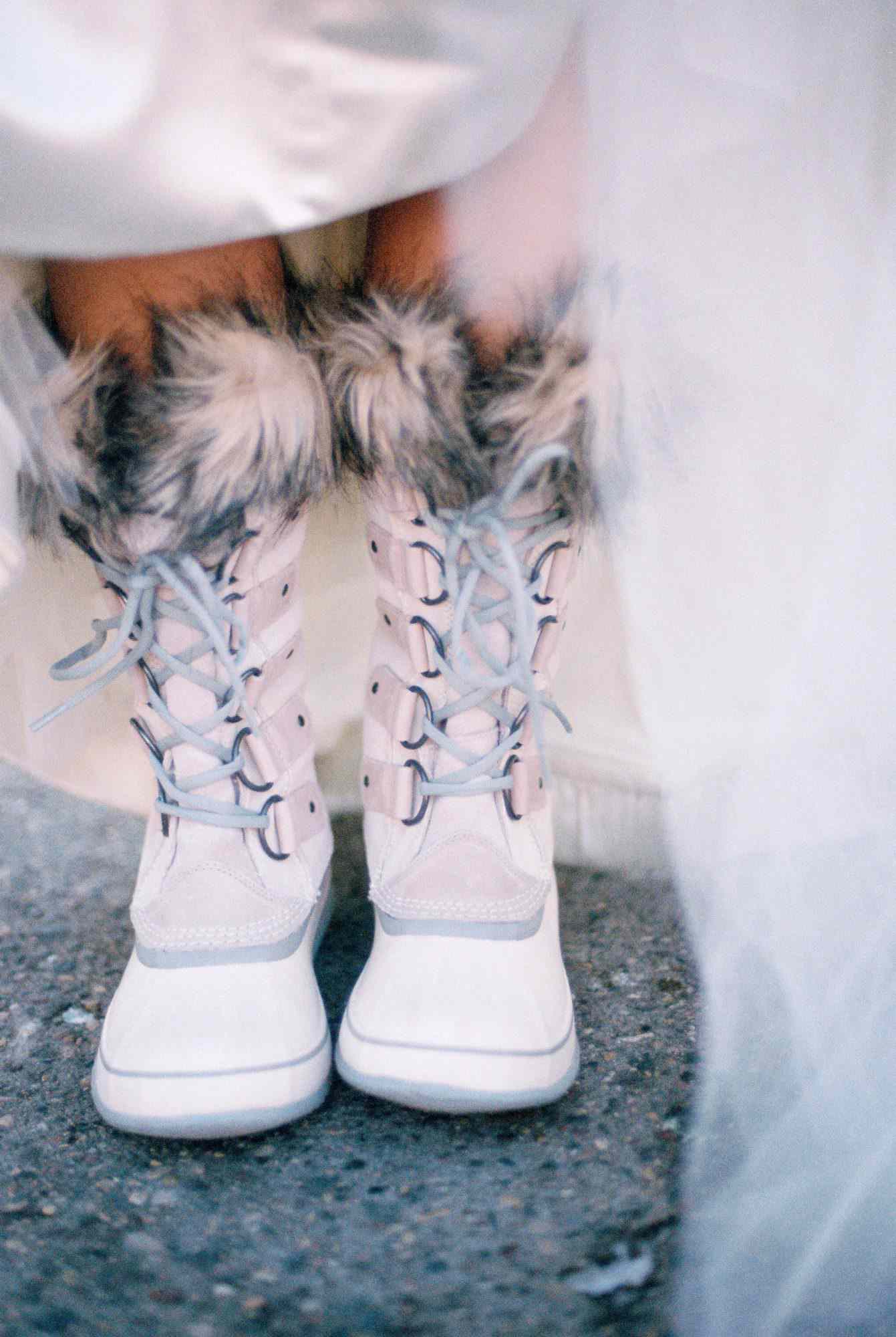 bride wearing winter boots