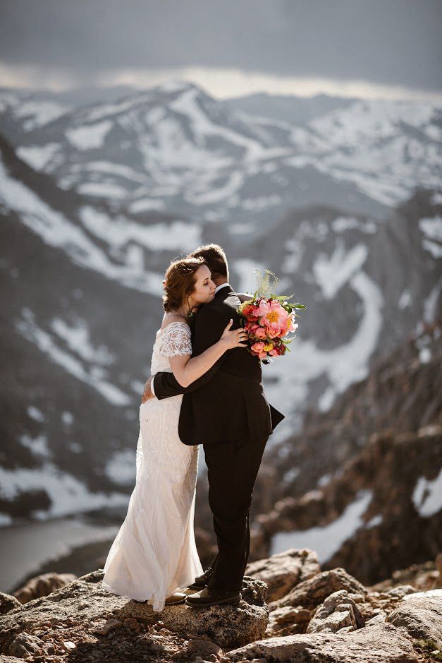 couple embracing on mountain