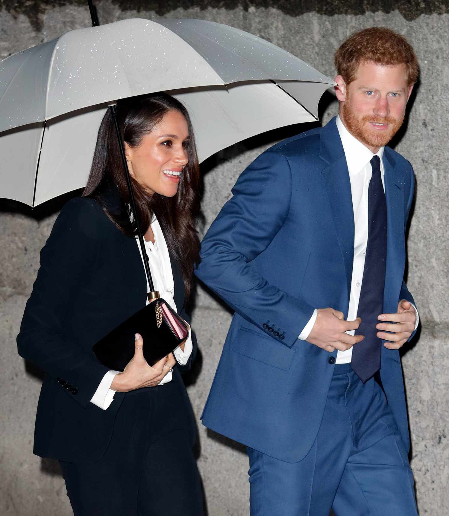 Meghan Markle and Prince Harry with Umbrella