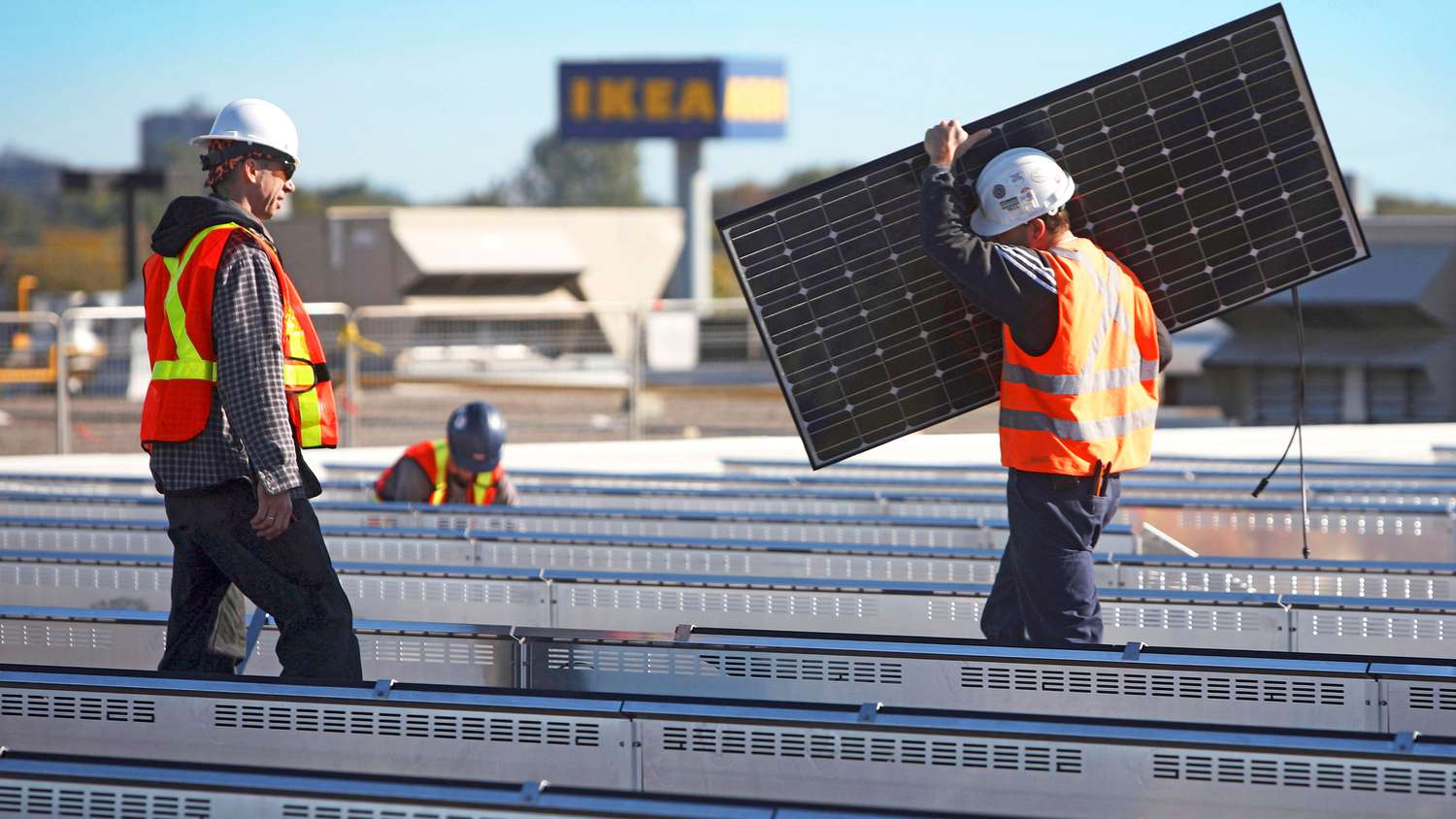 Ikea installing solar panels on rooftop