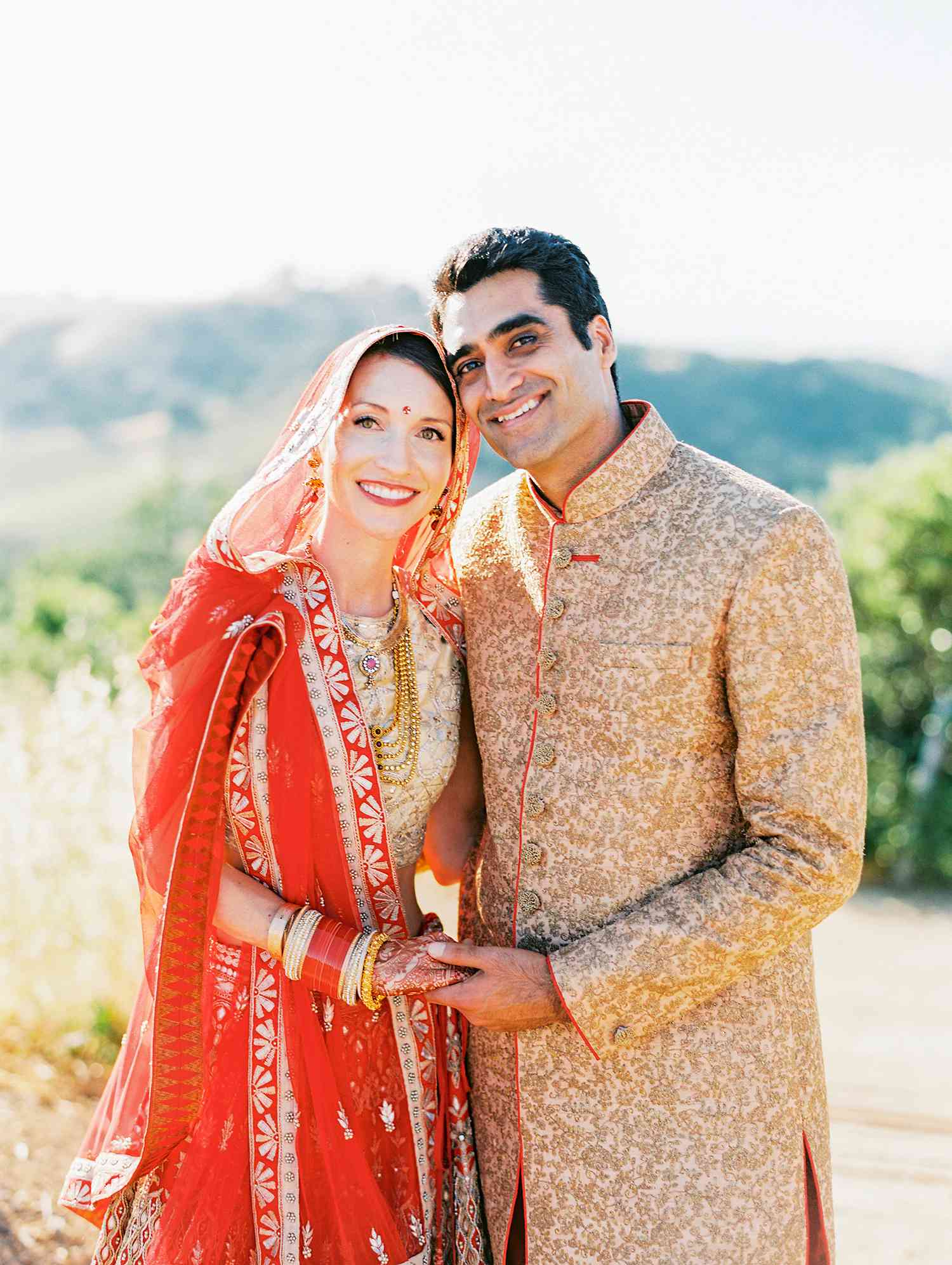 caitlin amit indian wedding couple holding hands