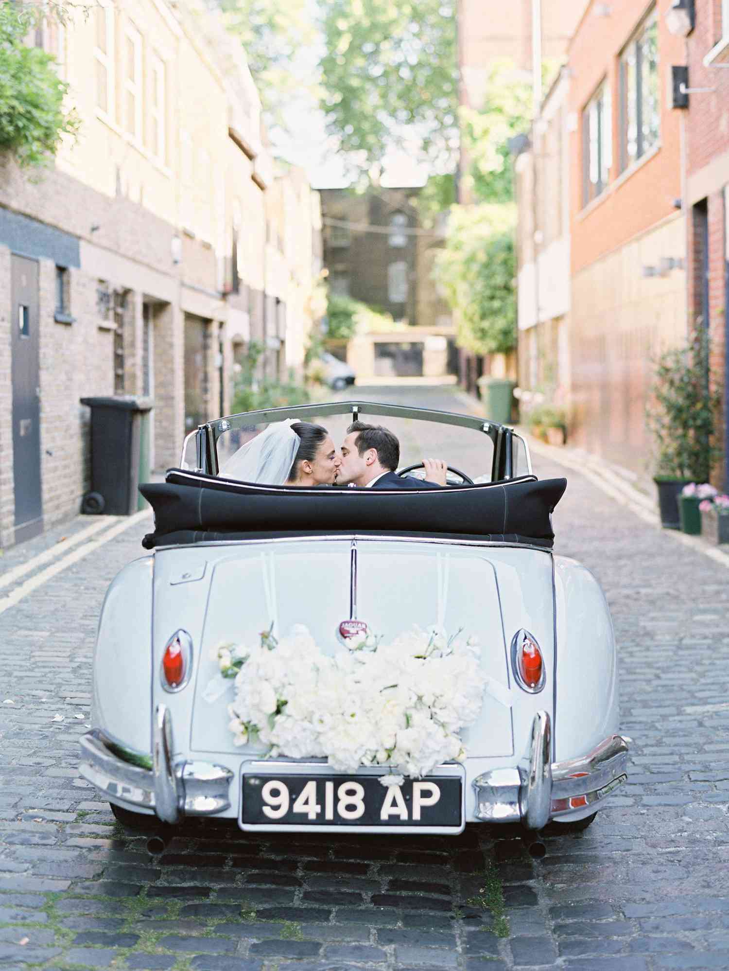Wedding car kiss