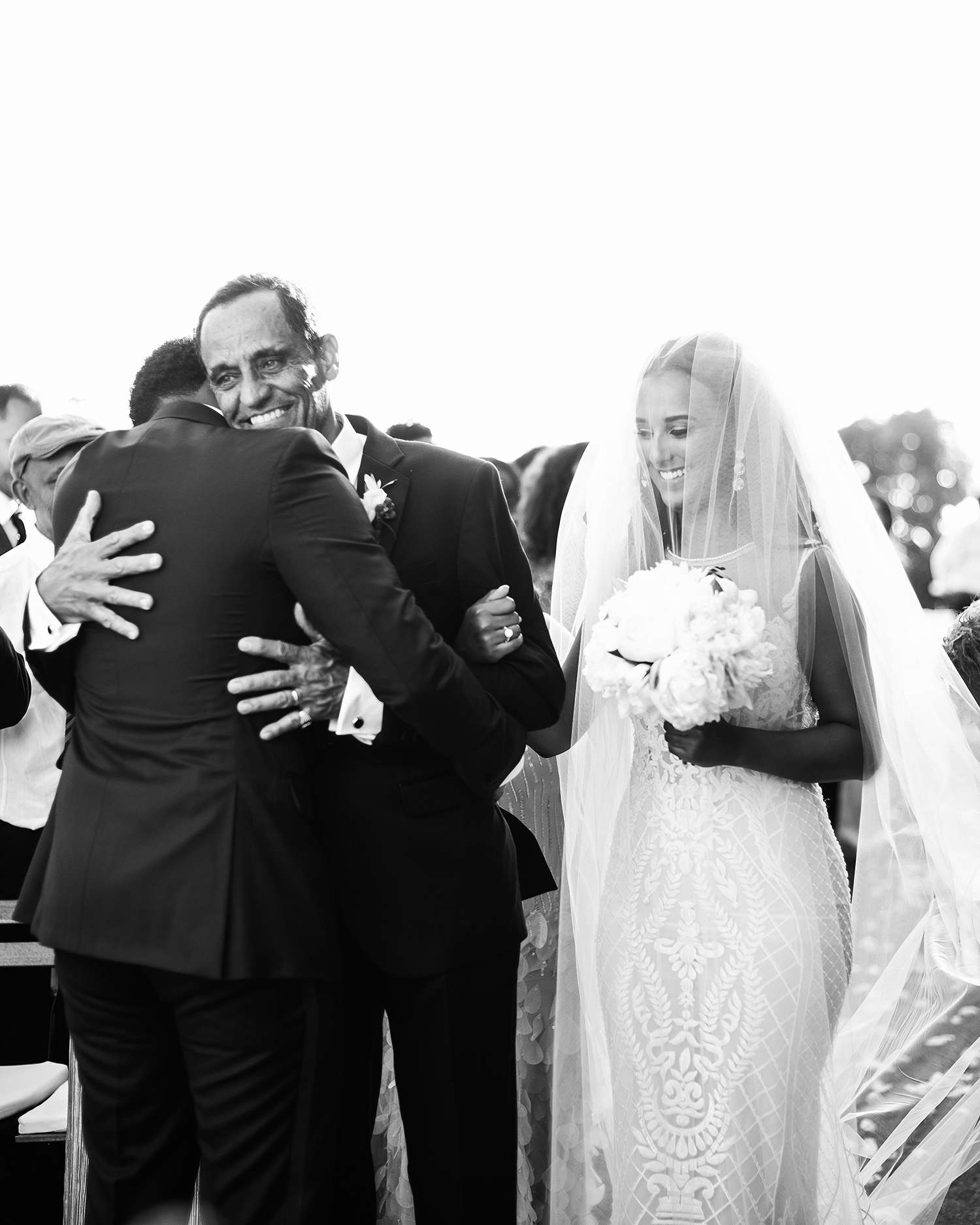 veronica mickias wedding groom and father embrace