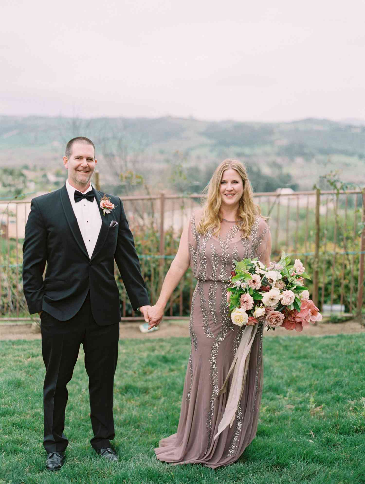 surprise wedding couple holding hands valley overlook