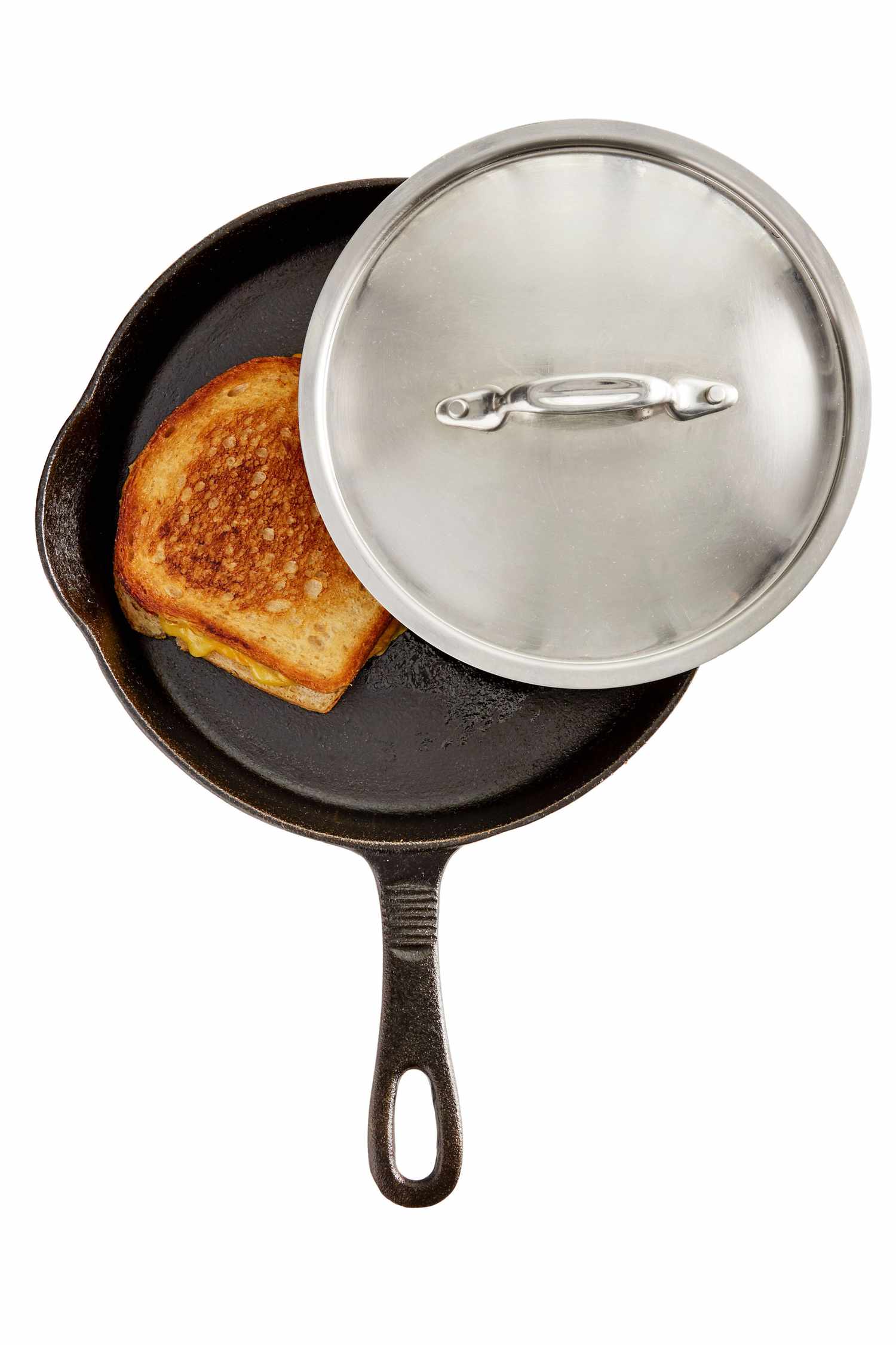 grilled cheese in pan with lid