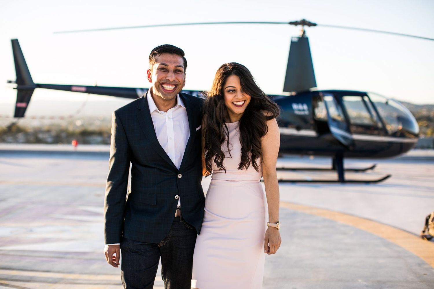 outdoor engagement photo with helicopter
