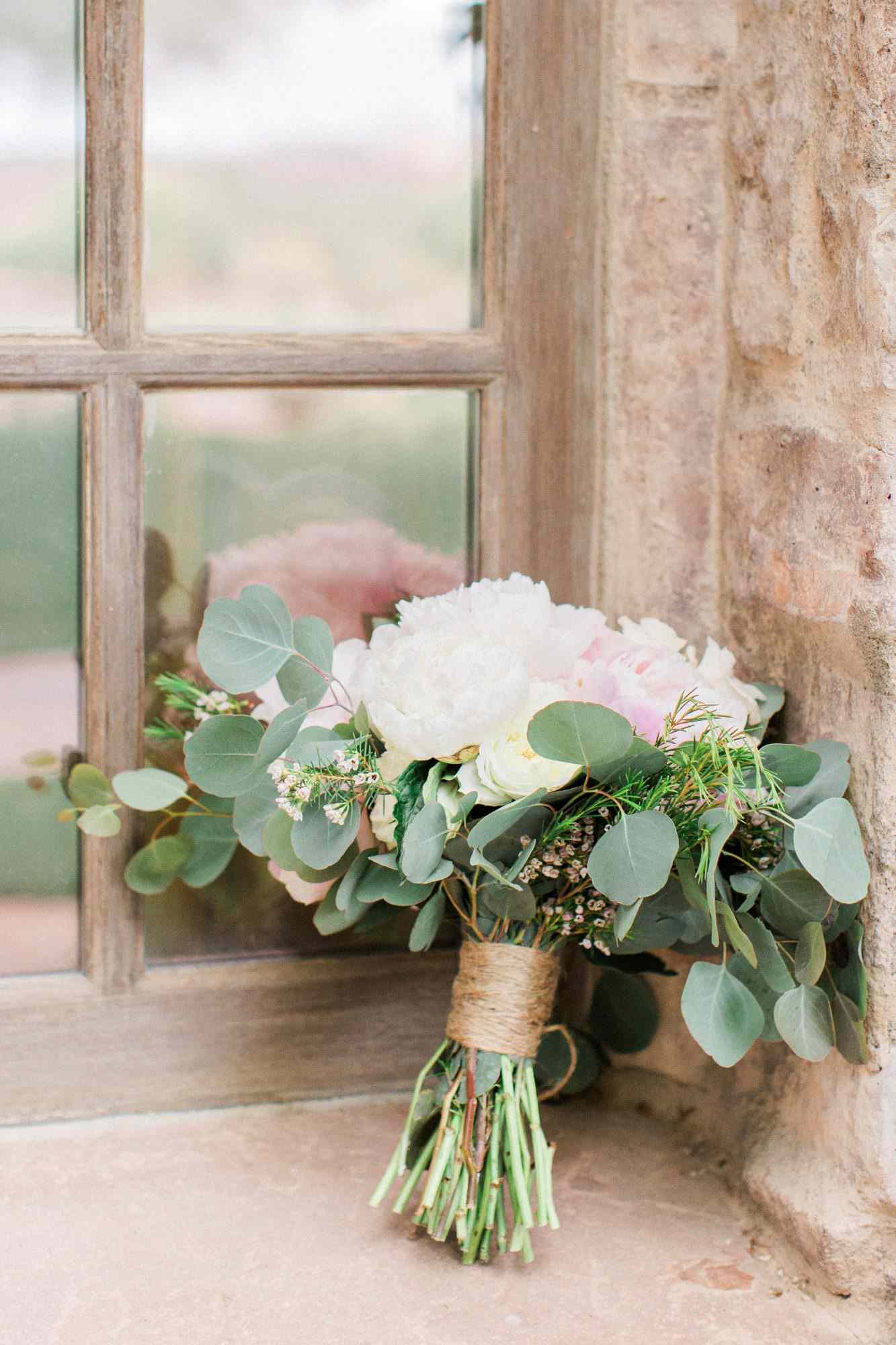 bouquet wraps flowers twine resting against window