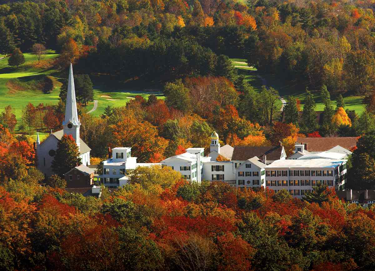 idyllic vermont town surrounded by fall foliage