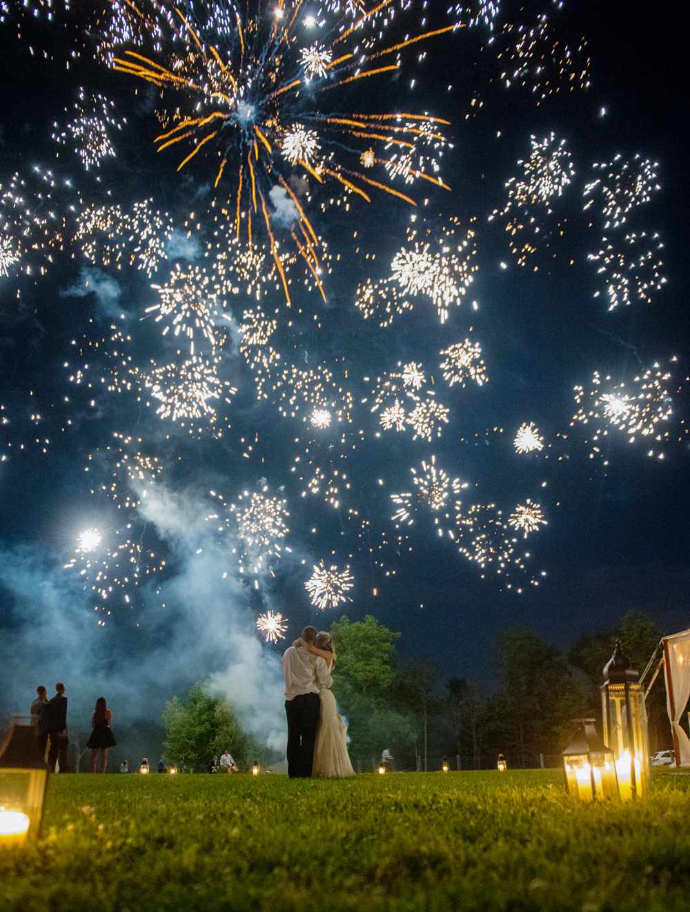 after party decor bride and groom beneath fireworks