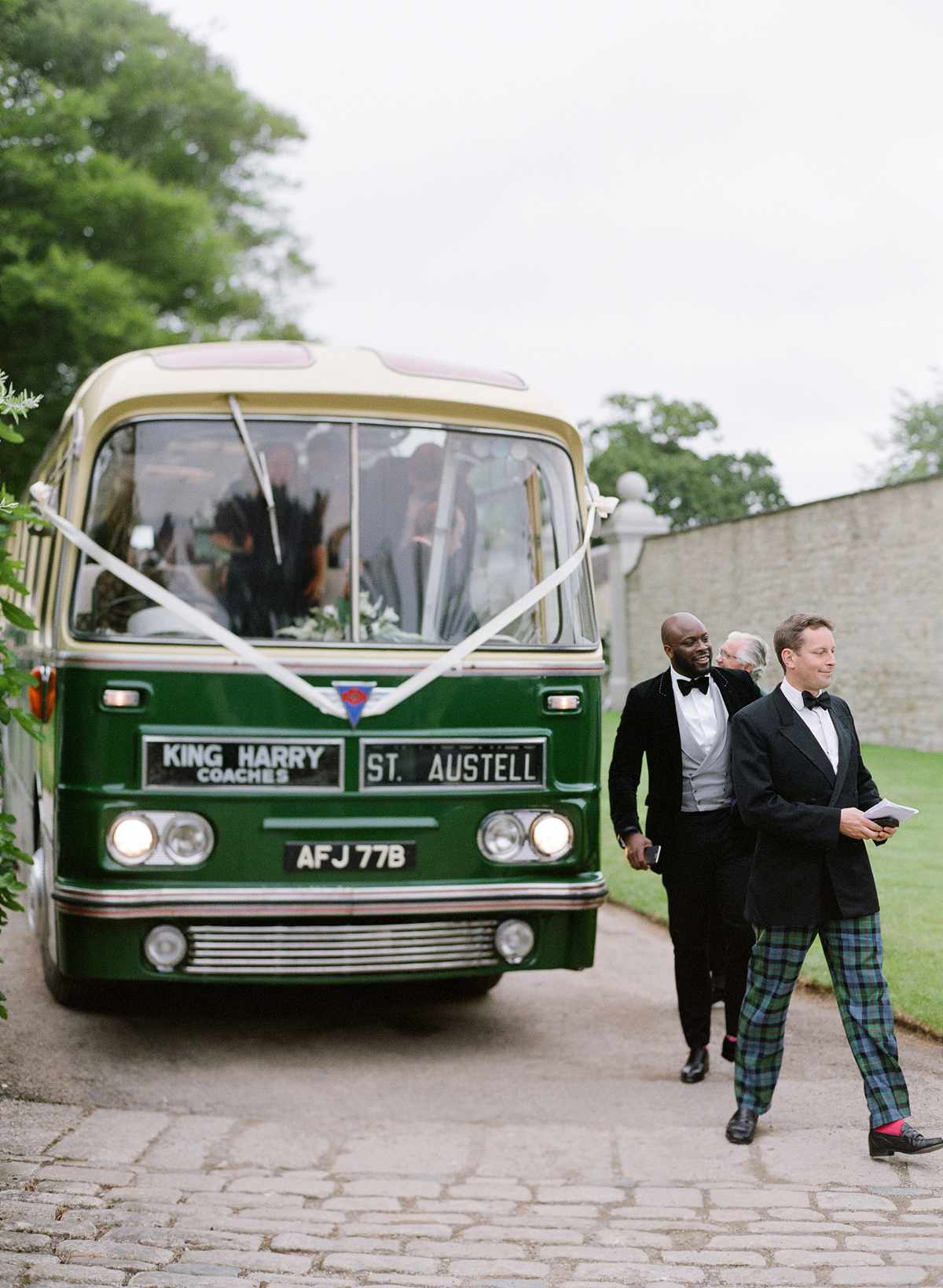 peony matthew england wedding groomsmen exiting shuttle